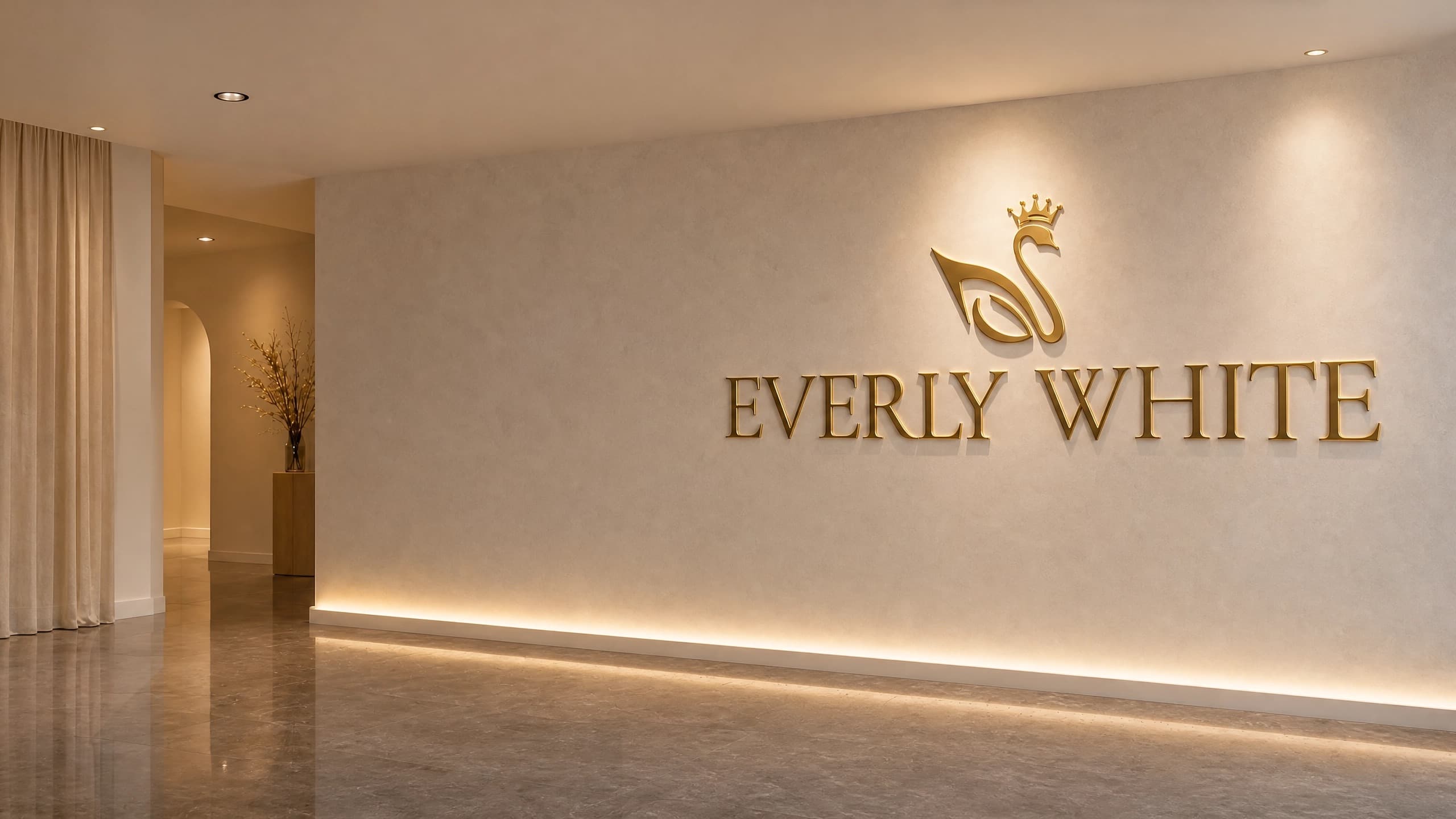 Everly White gold signage on a studio wall.